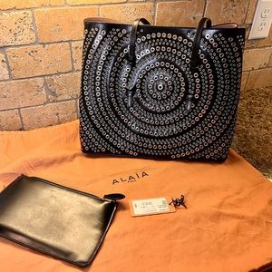 Alaia grommet black tote
